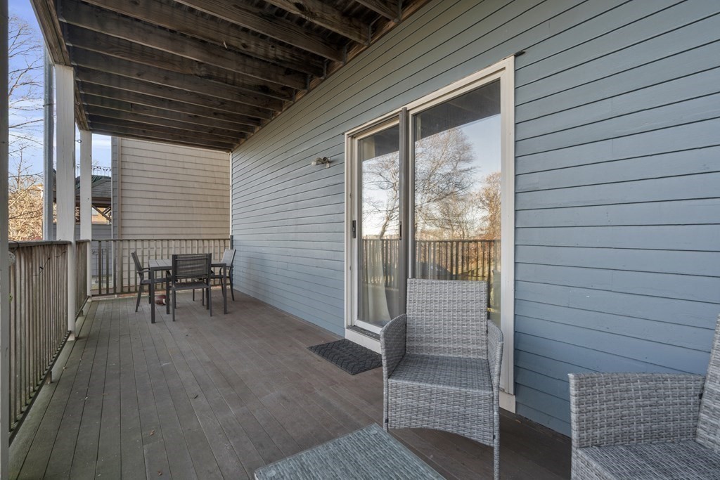 100 Calumet Street Boston, MA 02120 - Photo 41 of 42 a view of a porch with wooden floors and bench