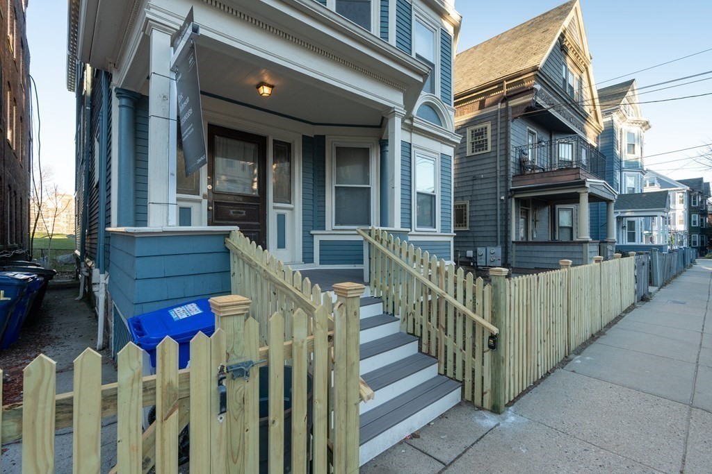 100 Calumet Street Boston, MA 02120 - Photo 42 of 42 a view of a house with wooden fence and two windows