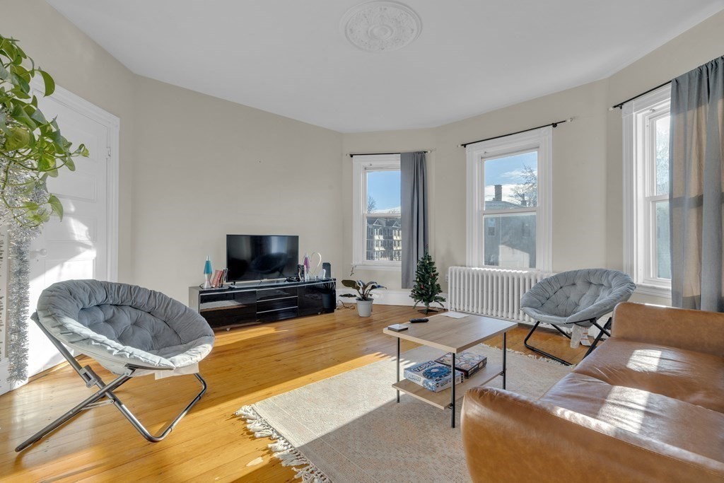100 Calumet Street Boston, MA 02120 - Photo 5 of 42 a living room with furniture and a flat screen tv
