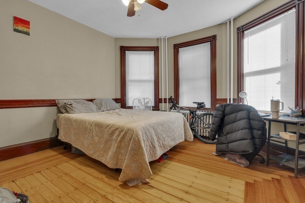 100 Calumet Street Boston, MA 02120 - Photo 6 of 42 a spacious bedroom with a bed and a large window