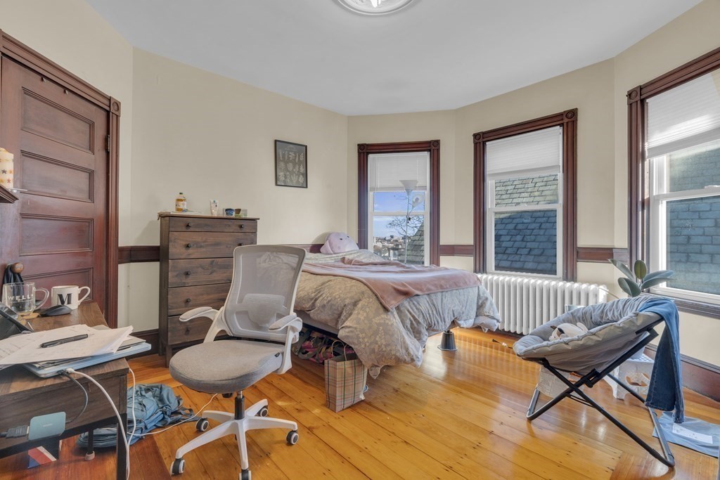 100 Calumet Street Boston, MA 02120 - Photo 9 of 42 a bed room with furniture and a window