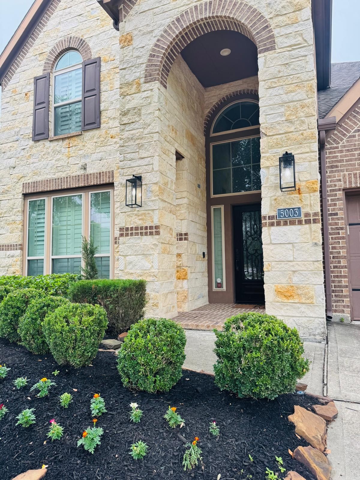 5003 Raudabaugh Drive Katy, TX 77494 - Photo 2 of 36 a front view of a house with garden