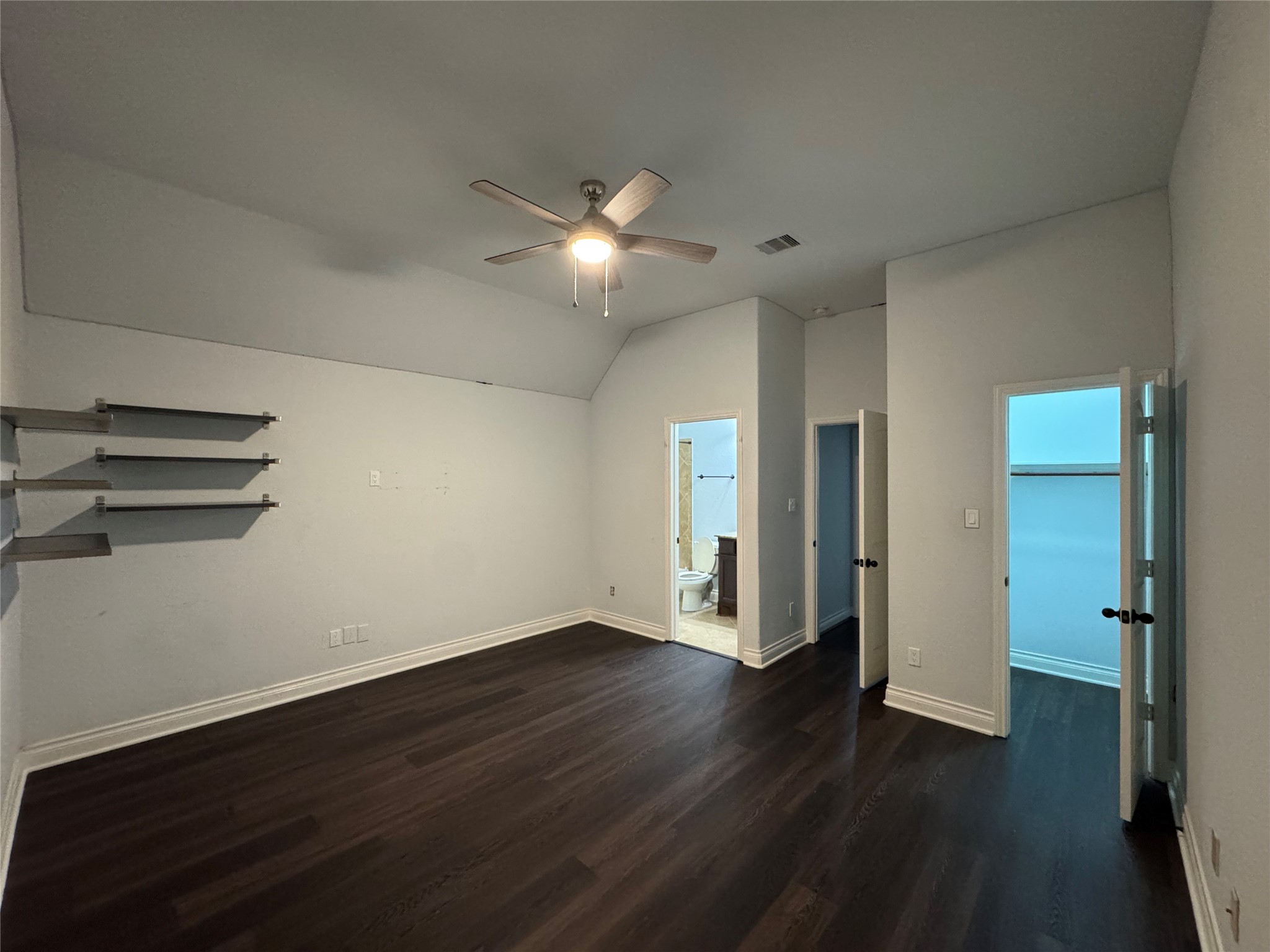5003 Raudabaugh Drive Katy, TX 77494 - Photo 23 of 36 a view of an empty room with wooden floor and a ceiling fan