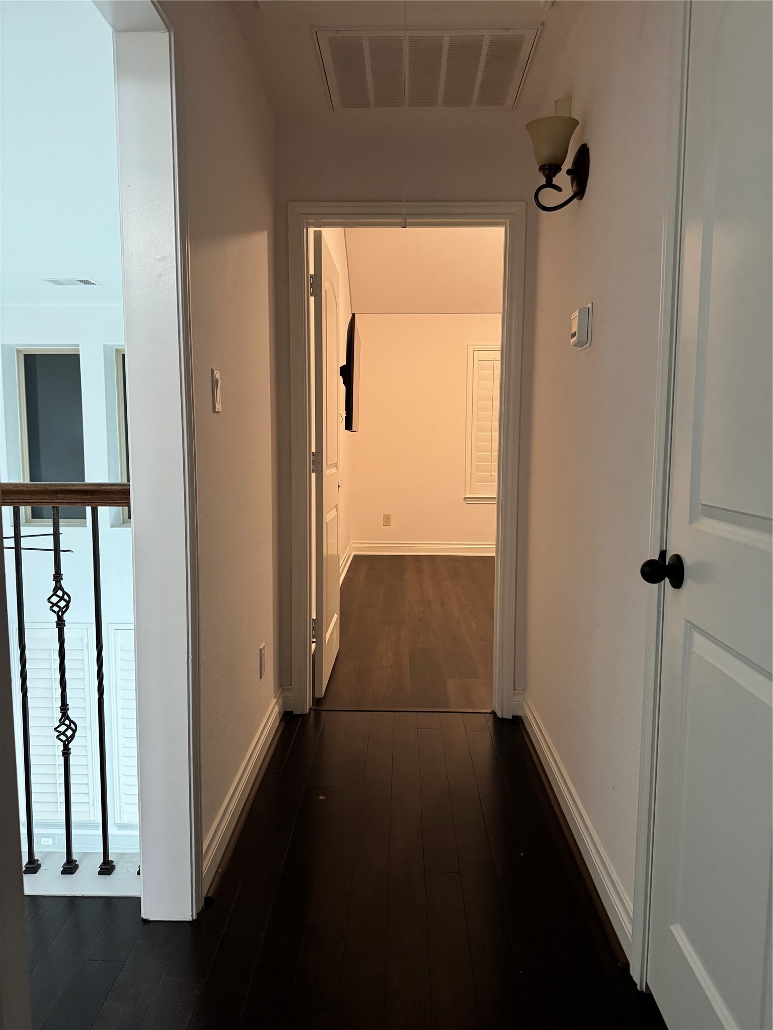 5003 Raudabaugh Drive Katy, TX 77494 - Photo 27 of 36 a view of a hallway with wooden floor and a cabinet
