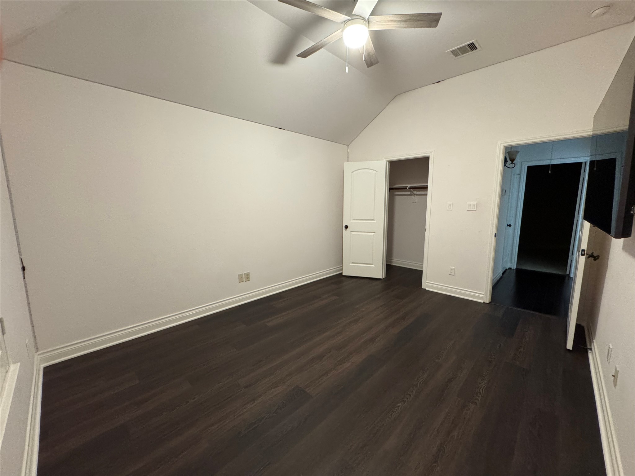 5003 Raudabaugh Drive Katy, TX 77494 - Photo 30 of 36 an empty room with wooden floor and fan