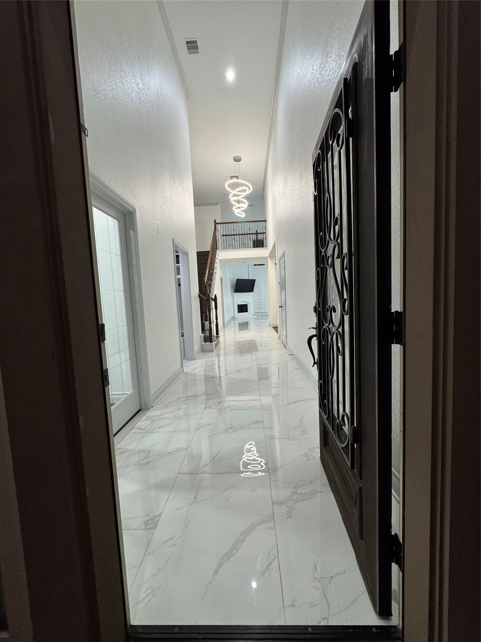 5003 Raudabaugh Drive Katy, TX 77494 - Photo 3 of 36 a view of a hallway with wooden floor and staircase