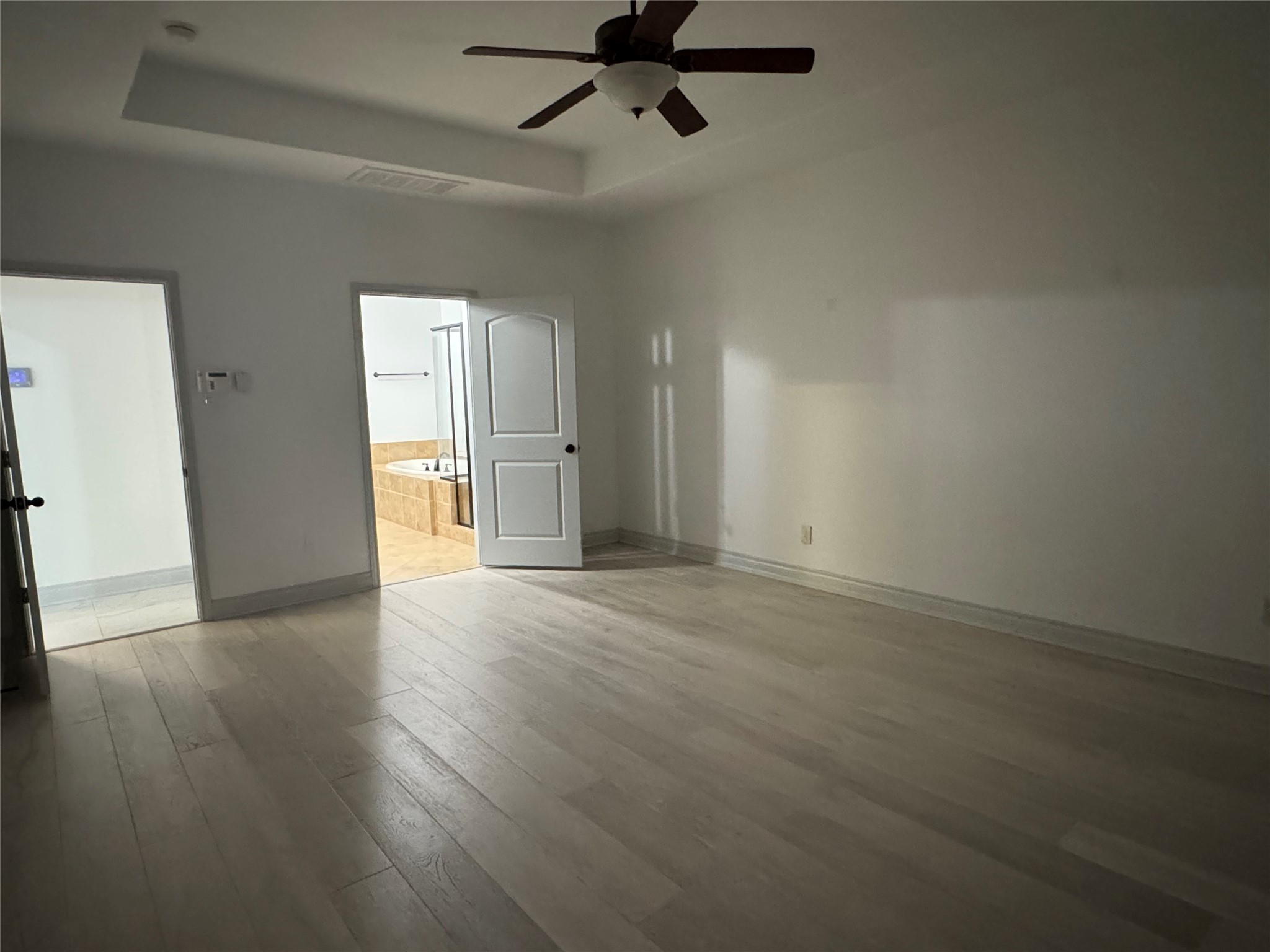 5003 Raudabaugh Drive Katy, TX 77494 - Photo 32 of 36 an empty room with wooden floor and windows