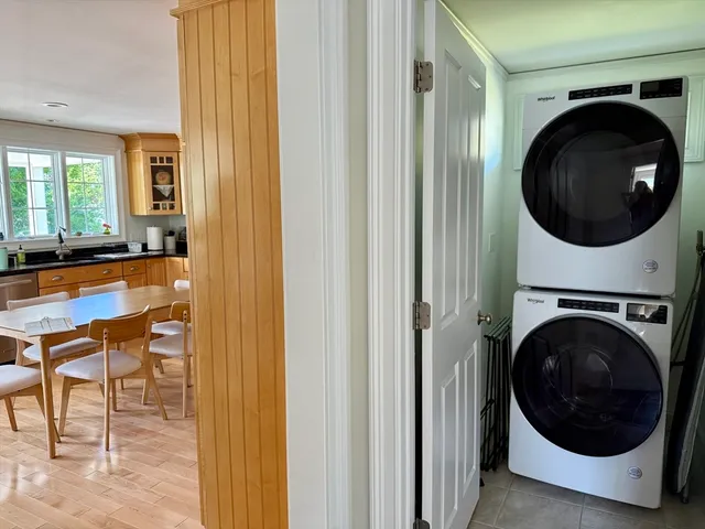 a view of a hallway with washer and dryer