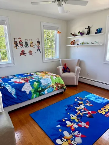 a bedroom with bed and window