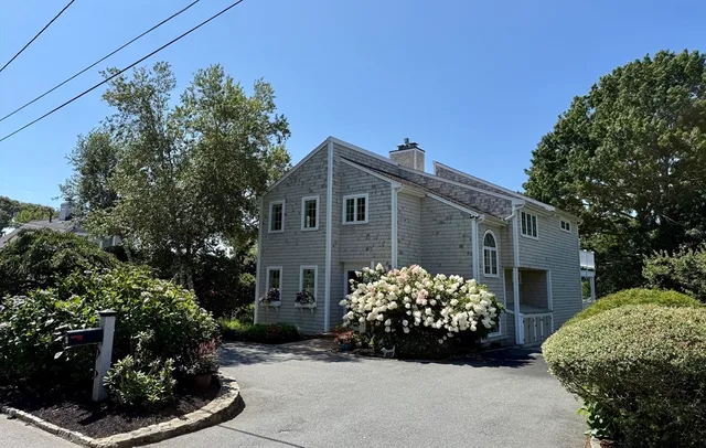 a view of a garden with a house