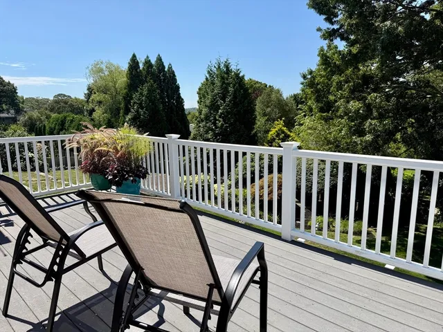a view of a wooden bench on roof deck