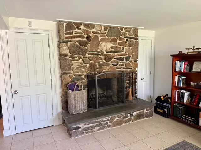 a living room with a couch and a fireplace