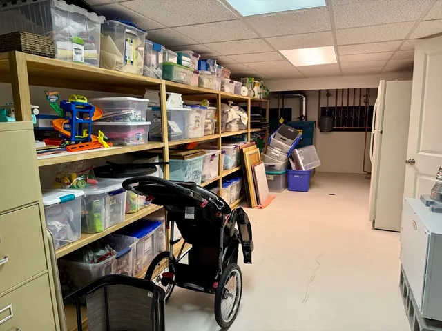 a view of a chairs and table on the roof deck