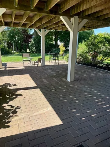 a view of a wooden deck and a garden