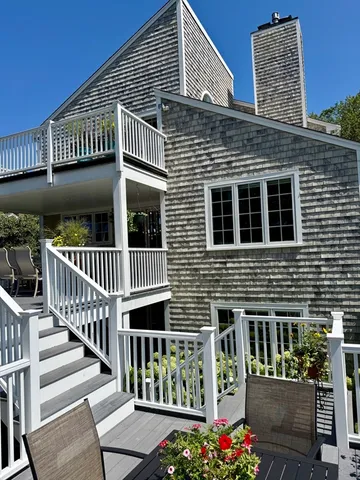 a grassy field with trees in the background