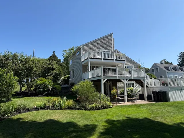 a view of a backyard with plants and flowers