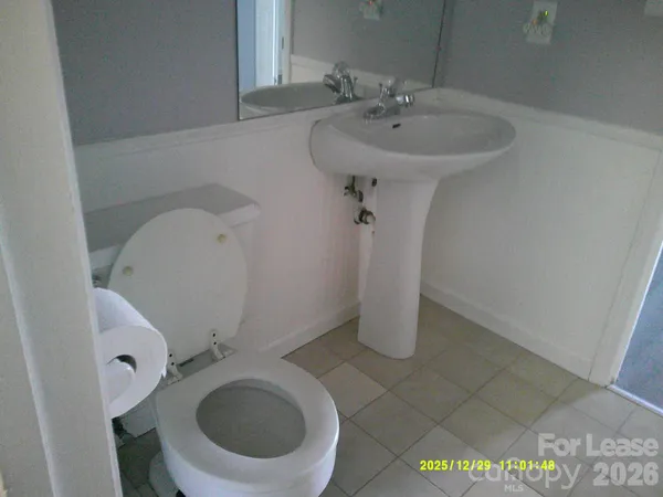 a bathroom with a sink and toilet