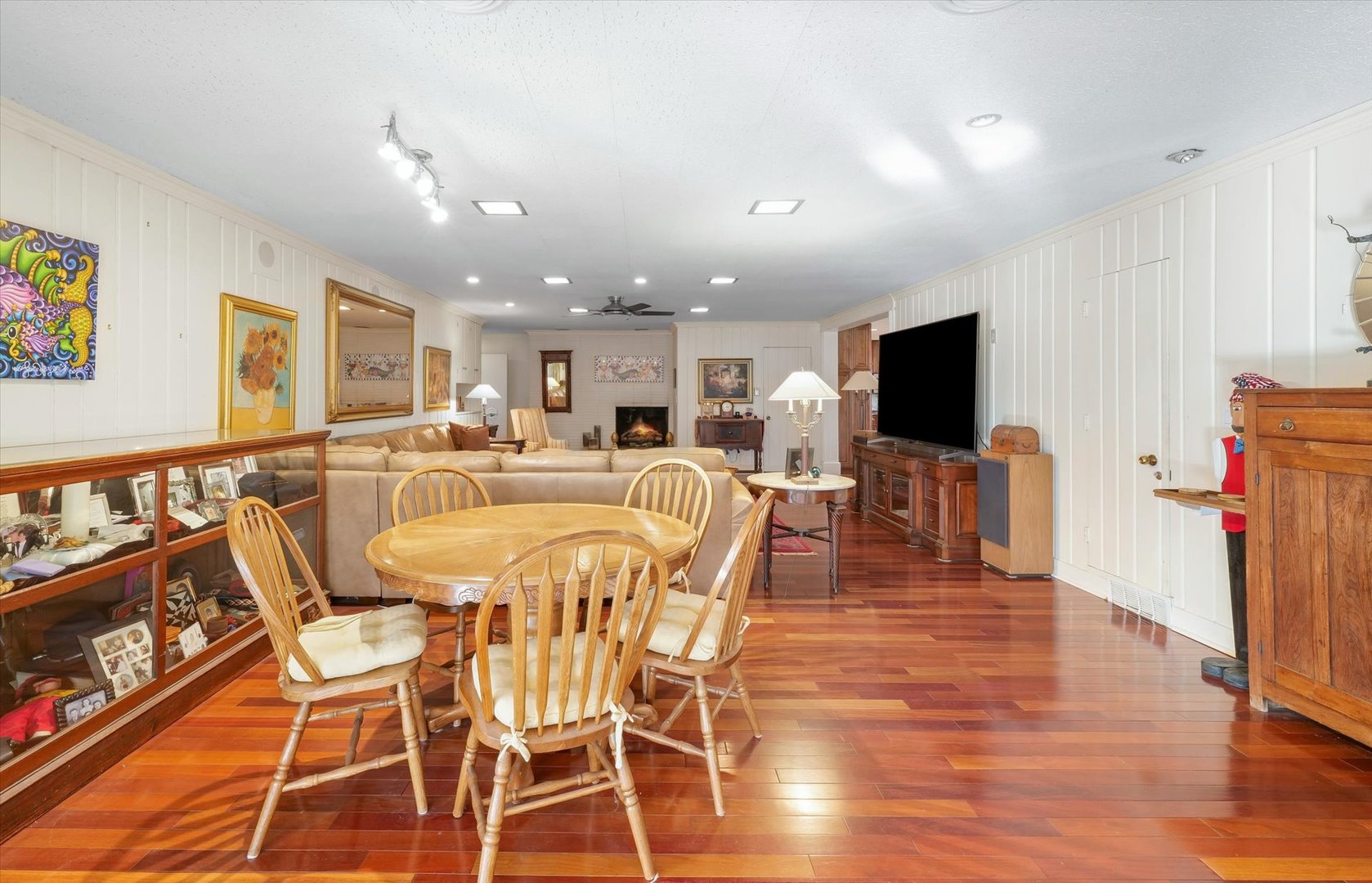22 Greencroft Drive Champaign, IL 61821 - Photo 45 of 90 a view of a dining room with furniture wooden floor and a flat screen tv