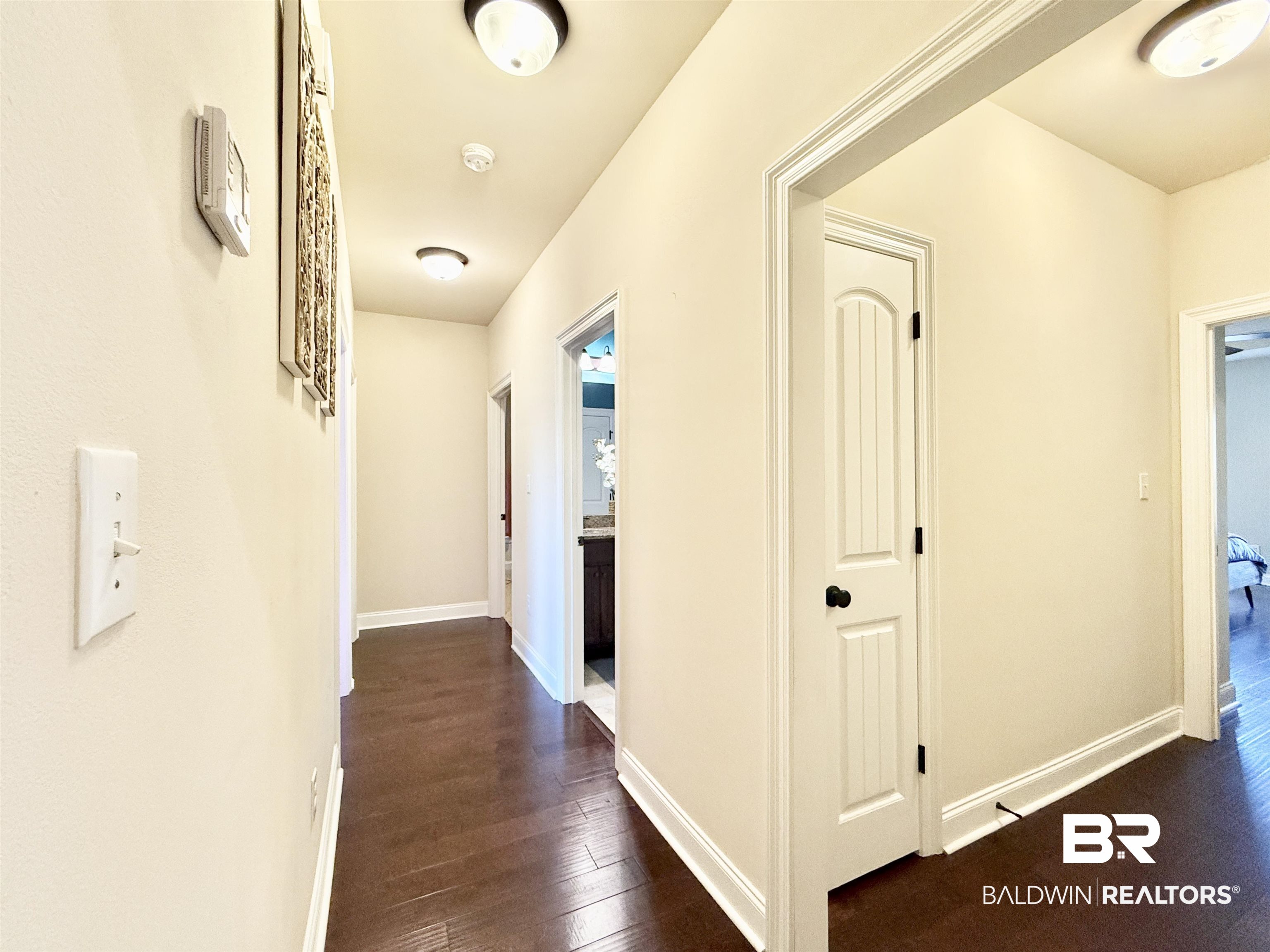 7011 Rocky Rd Loop Gulf Shores, AL 36542 - Photo 20 of 66 Hall featuring dark wood-style flooring and baseboards