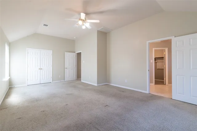 a view of empty room with fan