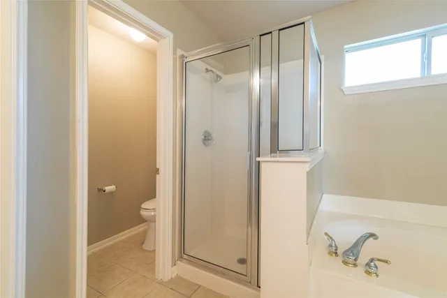 a bathroom with a bathtub and a sink