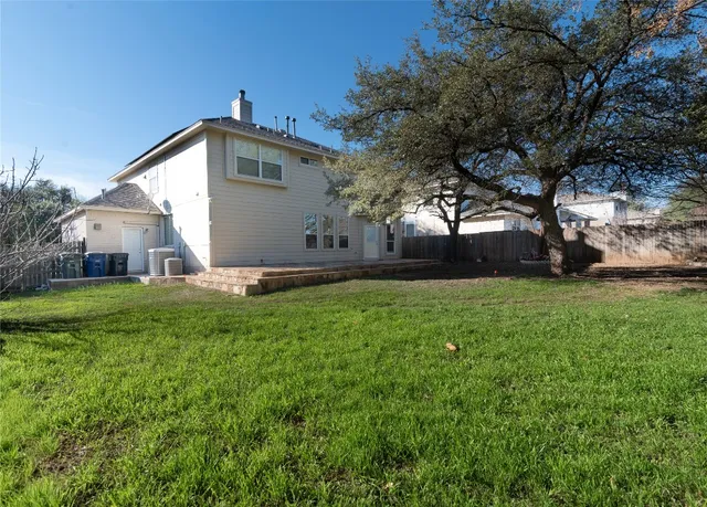 a backyard of a house with lots of green space