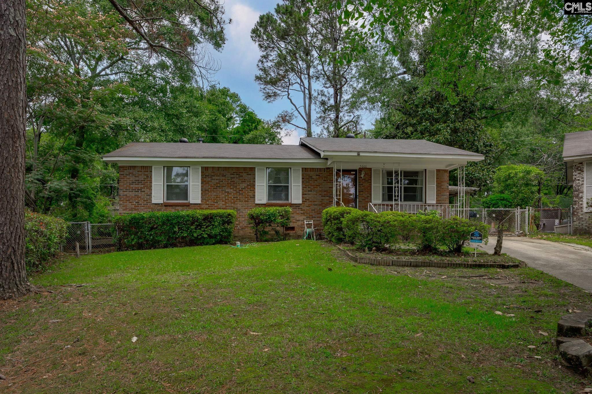 5666 Middleton Court Columbia, SC 29203 - Photo 2 of 42 a front view of a house with a yard
