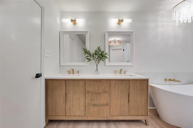 a bathroom with a bathtub and a sink
