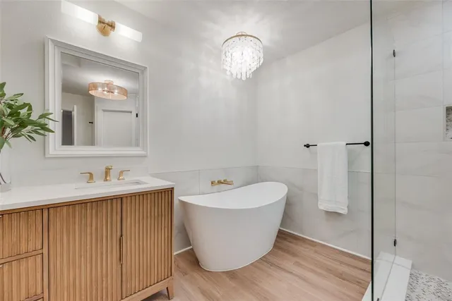 a bathroom with a bathtub and shower