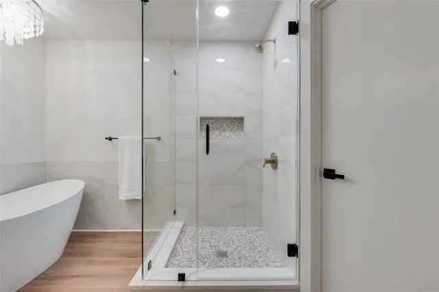 a spacious bathroom with a toilet a sink and a mirror