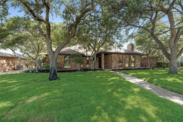a backyard of a house with lots of green space