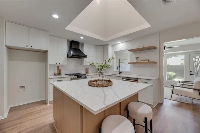 a kitchen with a stove a sink and a refrigerator