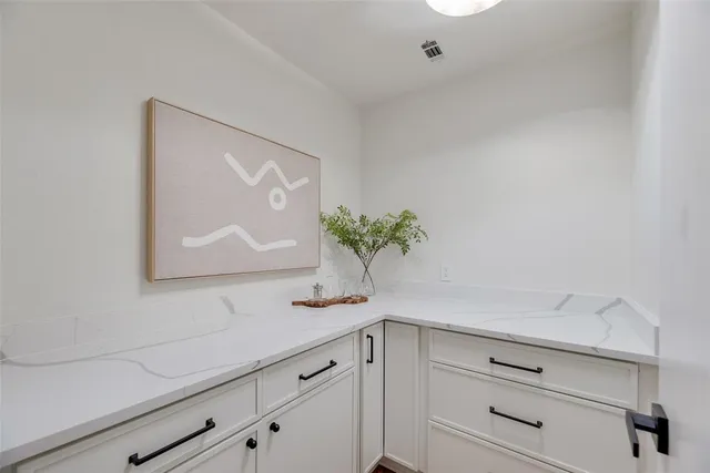 a view of a dining room with furniture a chandelier and wooden floor