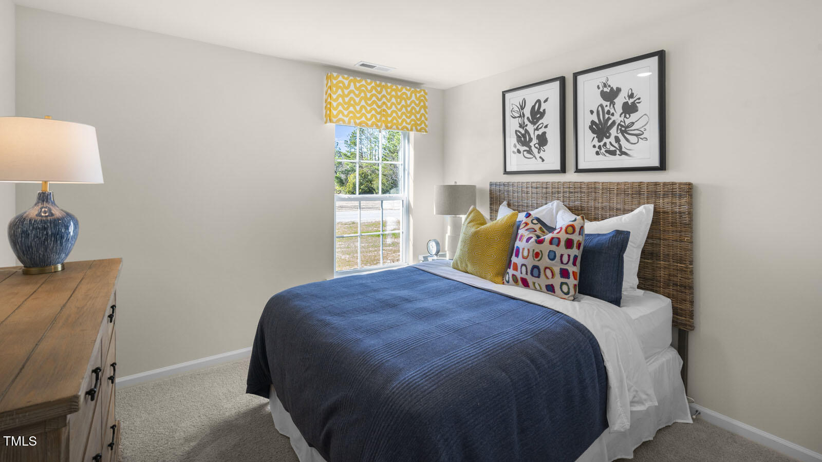 6017 Sodium Street Raleigh, NC 27610 - Photo 14 of 26 a bedroom with a bed and painting on the wall