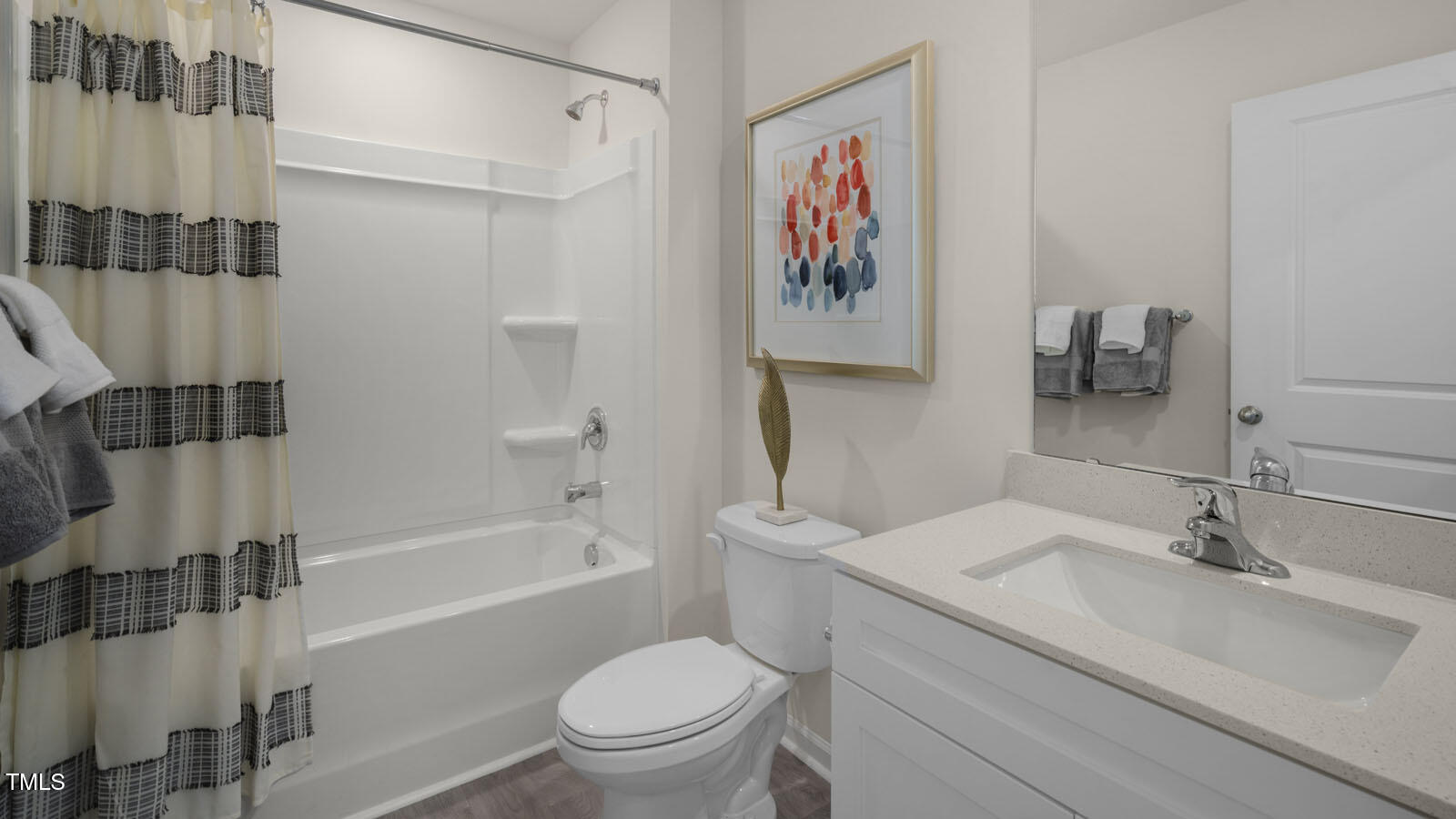 6017 Sodium Street Raleigh, NC 27610 - Photo 15 of 26 a bathroom with a sink toilet and shower