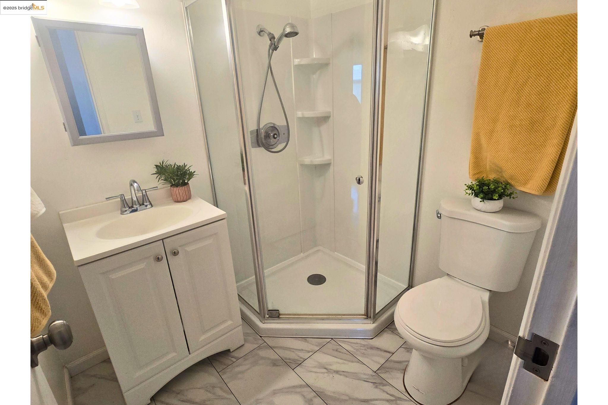 2036 Sierra Road, Unit 2 Concord, CA 94518 - Photo 16 of 32 Bathroom with vanity, a shower stall, and light marble finish flooring