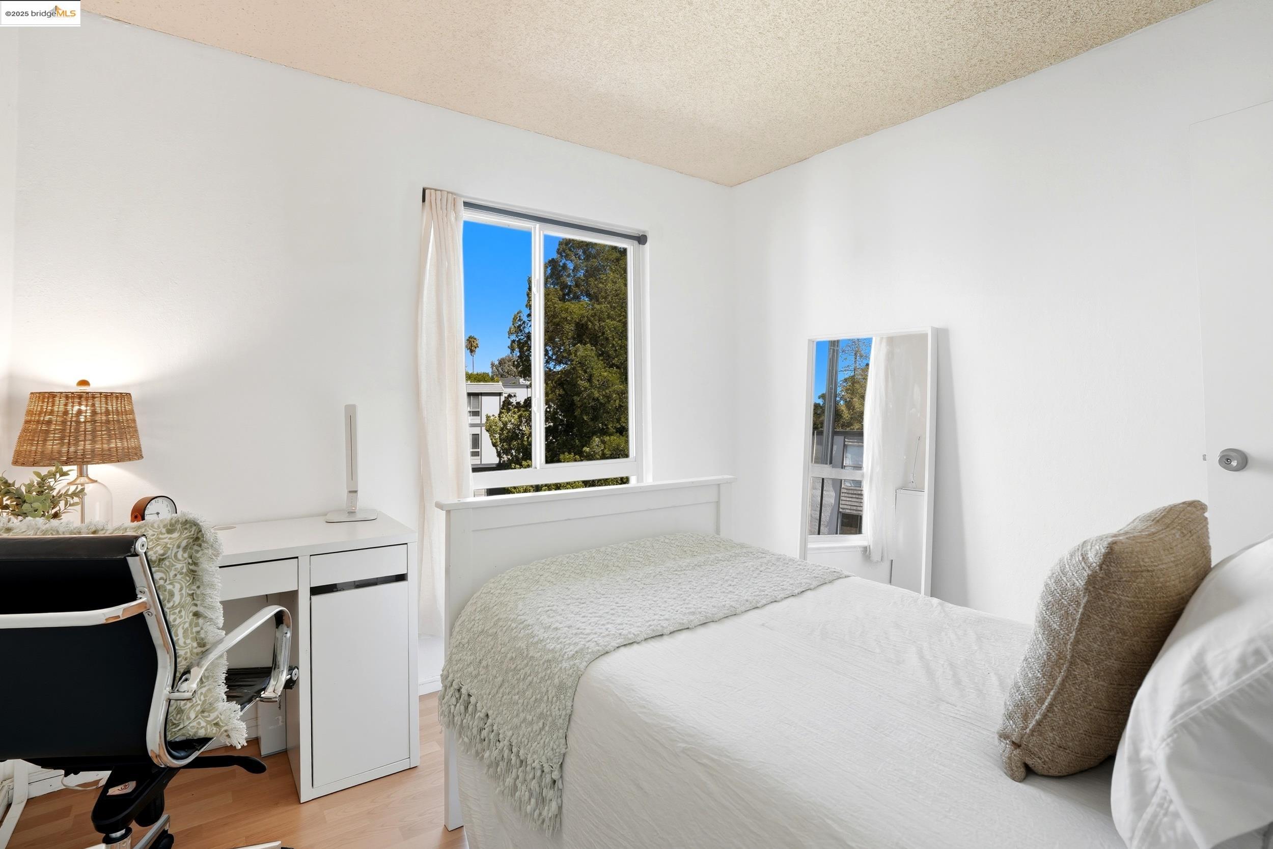 2036 Sierra Road, Unit 2 Concord, CA 94518 - Photo 19 of 32 Bedroom featuring light wood-style flooring, a desk, and a textured ceiling