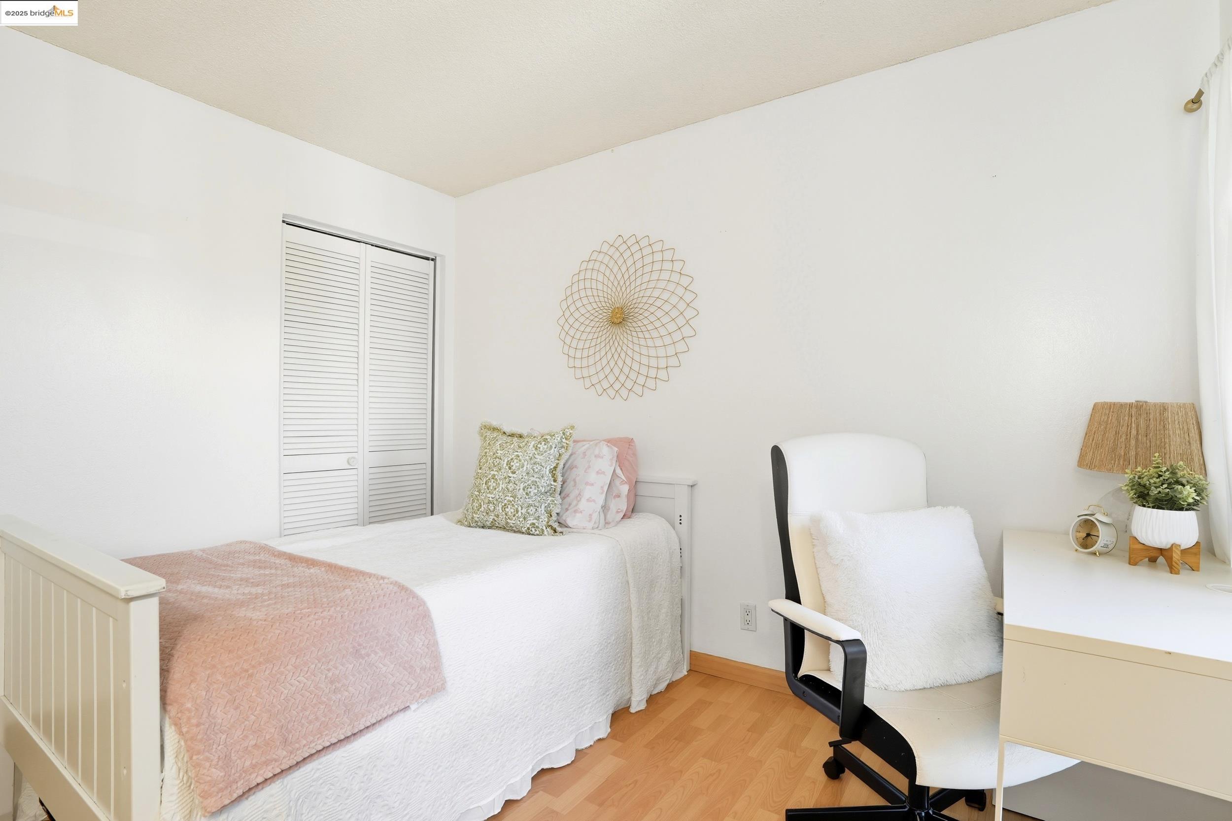 2036 Sierra Road, Unit 2 Concord, CA 94518 - Photo 20 of 32 Bedroom with light wood-style floors and a closet