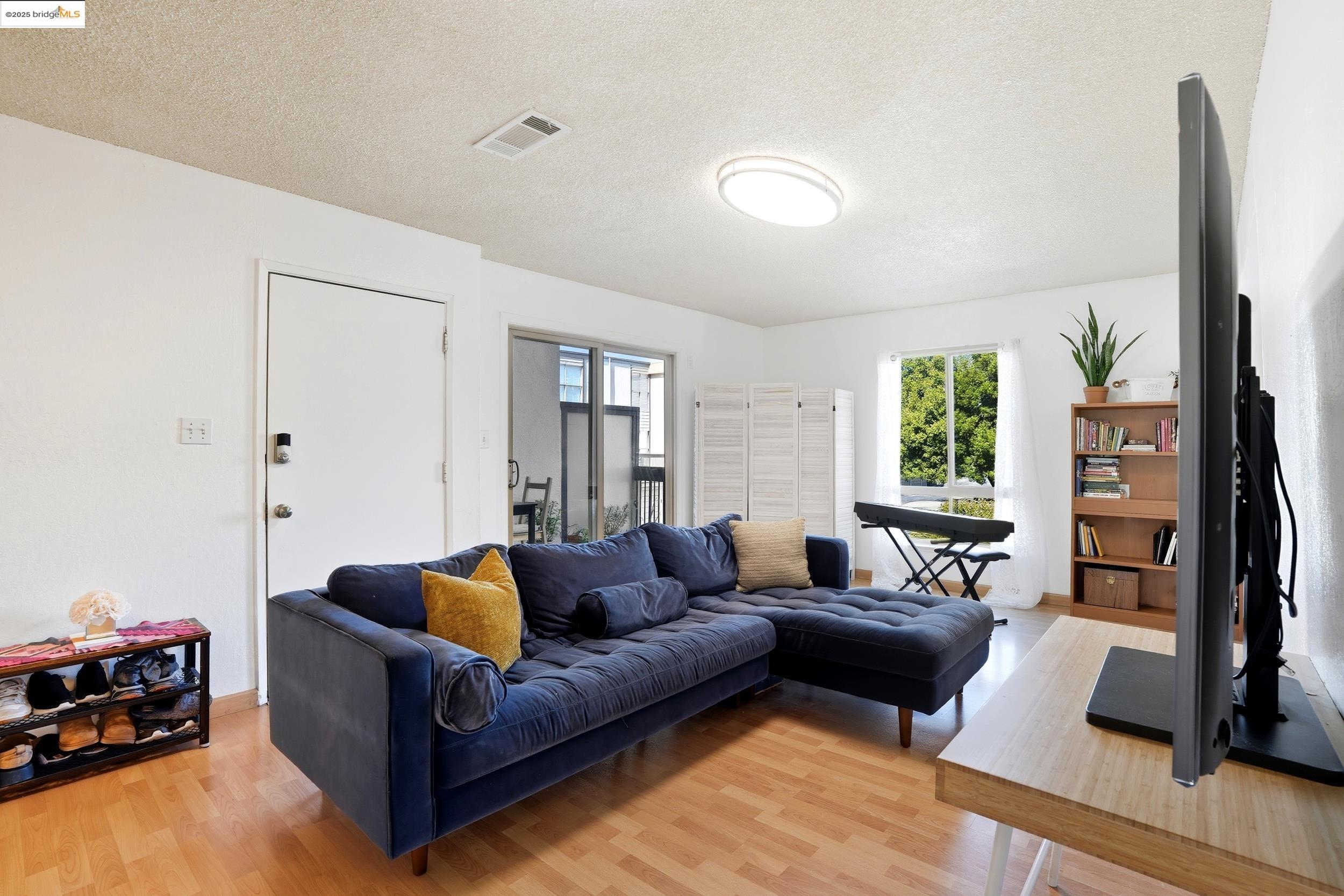 2036 Sierra Road, Unit 2 Concord, CA 94518 - Photo 2 of 32 a living room with furniture window and a flat screen tv