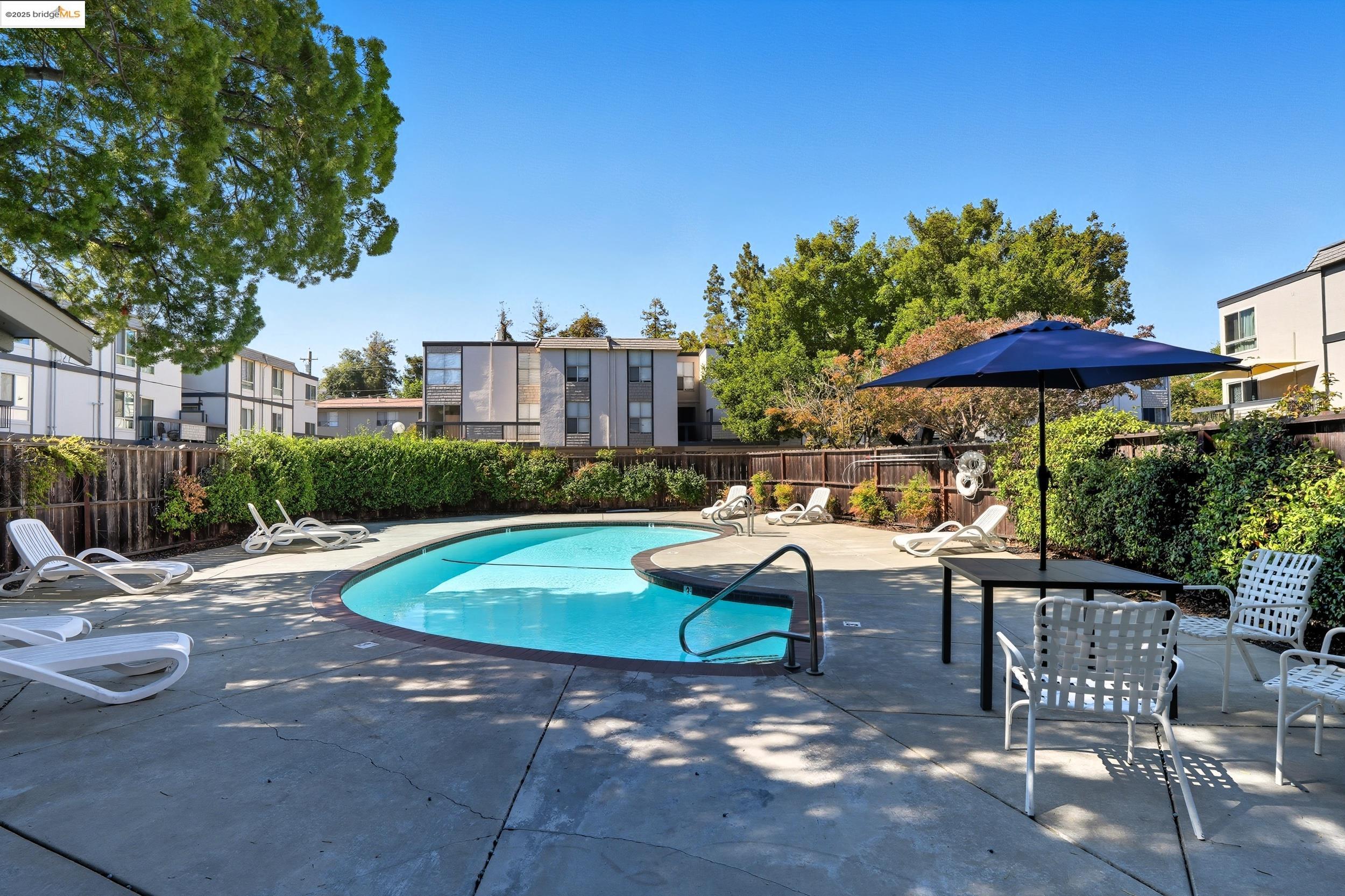 2036 Sierra Road, Unit 2 Concord, CA 94518 - Photo 27 of 32 Community pool with a patio