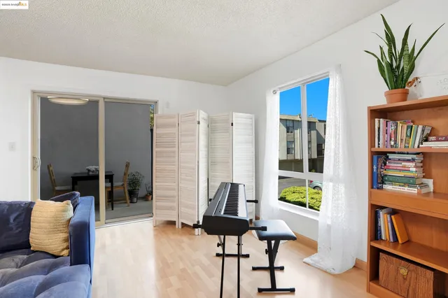 a view of a dining room with furniture and window