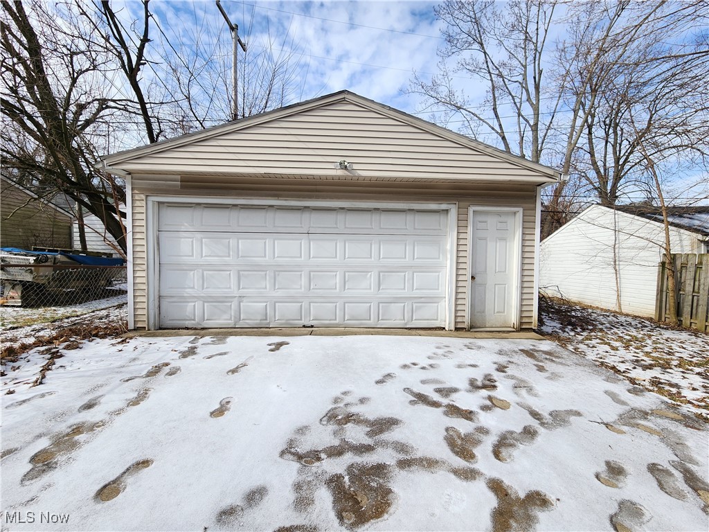 1160 Brentwood Road Cleveland, OH 44121 - Photo 3 of 26 View of a two car garage with man door