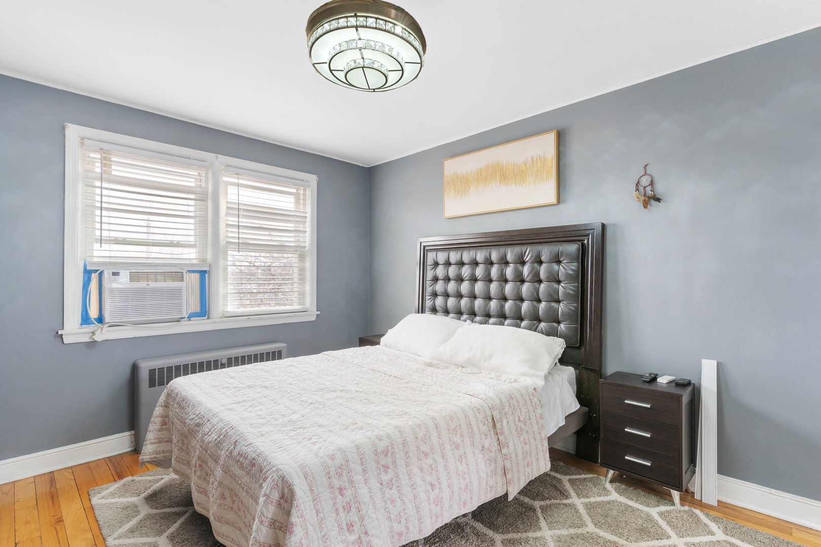 2204 South 9th Avenue, Unit 2 Broadview, IL 60155 - Photo 11 of 16 a bedroom with a bed and a table