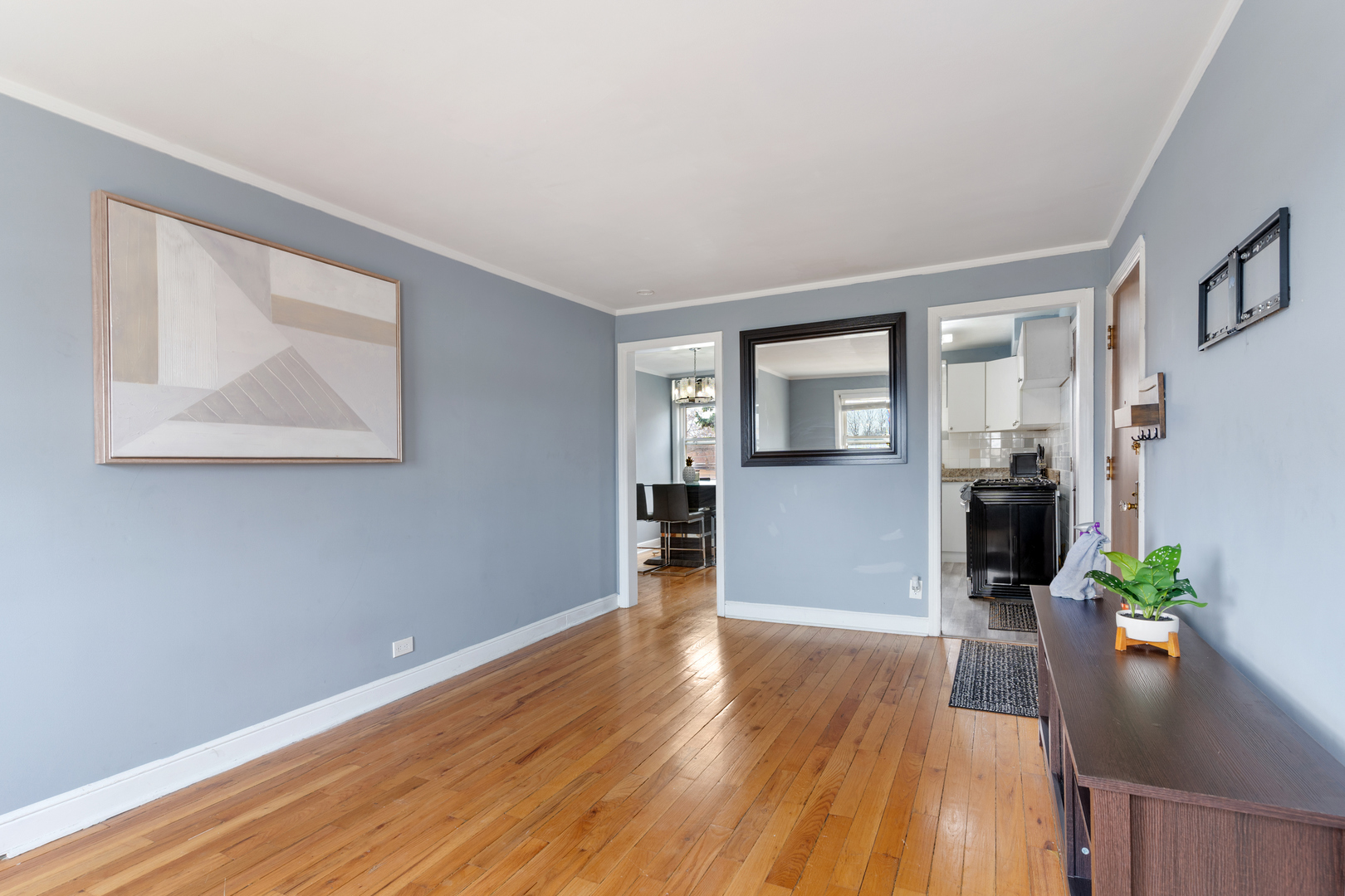 2204 South 9th Avenue, Unit 2 Broadview, IL 60155 - Photo 3 of 16 a view of a big room with wooden floor and windows
