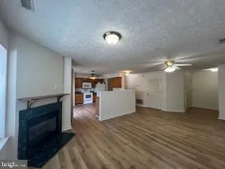 a view of a livingroom with furniture and a fireplace