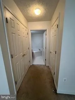 a view of a bathroom with tub and shower