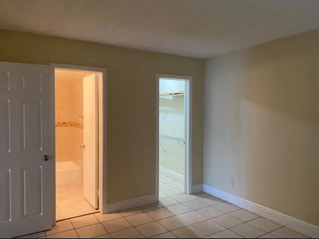 a bathroom with a toilet and a bathtub