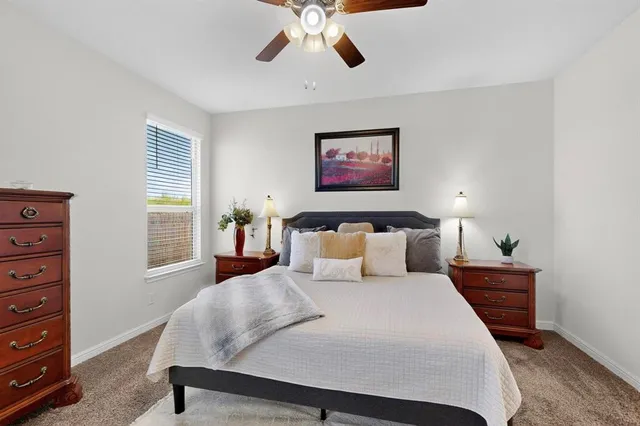 a bed room with a bed and a chandelier