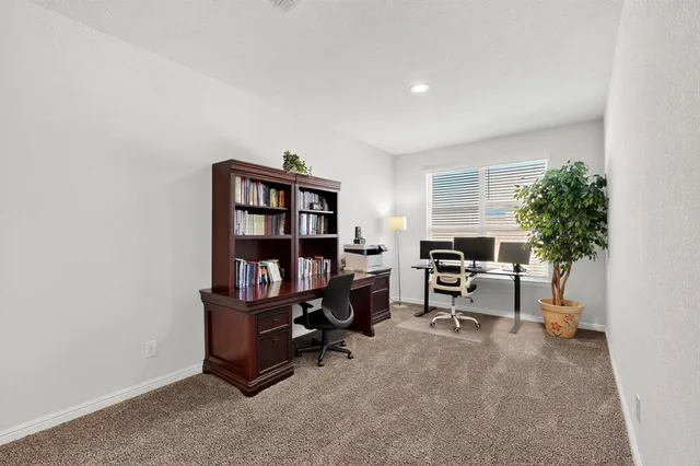 a view of a workspace with furniture