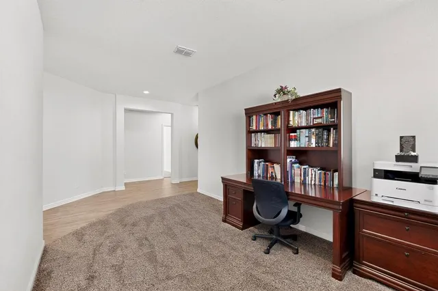 a view of a workspace with furniture